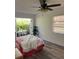 Bedroom boasts natural light, ceiling fan, hardwood floors, and private patio access at 355 Highland Shores Dr, Ellenton, FL 34222