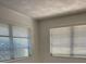 A sunny room with two windows and blinds, providing lots of natural light at 355 Highland Shores Dr, Ellenton, FL 34222