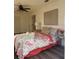 Bright bedroom has a ceiling fan, a grey bed with throw blanket, and modern decor at 355 Highland Shores Dr, Ellenton, FL 34222