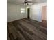 This bedroom has bright natural light, wood-look flooring and closet at 355 Highland Shores Dr, Ellenton, FL 34222