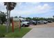Exterior view of the Highland Shores Boat Ramp, surrounded by lush greenery and ample parking space at 355 Highland Shores Dr, Ellenton, FL 34222
