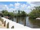 Waterfront image of a dock, featuring a serene river surrounded by lush vegetation at 355 Highland Shores Dr, Ellenton, FL 34222