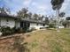 Charming single-story home with well-maintained lawn and landscape and a white exterior at 355 Highland Shores Dr, Ellenton, FL 34222