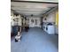 Clean garage space showcasing storage solutions, laundry setup, and room for parking at 355 Highland Shores Dr, Ellenton, FL 34222