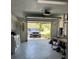 Open garage featuring laundry hookups, ample storage, and car parked inside at 355 Highland Shores Dr, Ellenton, FL 34222