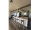 Open kitchen featuring large island with seating, modern lighting, and stainless steel appliances at 355 Highland Shores Dr, Ellenton, FL 34222