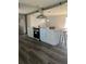 Kitchen features white cabinets, stainless steel appliances, and a large island with seating at 355 Highland Shores Dr, Ellenton, FL 34222
