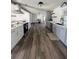 Spacious kitchen features gray cabinets and a large island with white cabinets and seating at 355 Highland Shores Dr, Ellenton, FL 34222