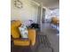 Comfortable seating area in screened-in porch with indoor-outdoor flow at 355 Highland Shores Dr, Ellenton, FL 34222