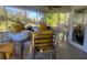 The screened-in porch offers a relaxing space with table and seating at 355 Highland Shores Dr, Ellenton, FL 34222