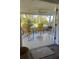 Comfortable seating area in screened-in porch with indoor-outdoor flow at 355 Highland Shores Dr, Ellenton, FL 34222
