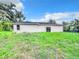 Spacious backyard featuring lush green grass and plenty of room for outdoor activities at 23113 Brewer Ave, Punta Gorda, FL 33980