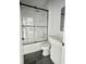Modern bathroom featuring a shower over tub, a white vanity, and a frameless glass door at 23113 Brewer Ave, Punta Gorda, FL 33980