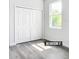 Bedroom with ample natural light from a window and a closet with folding doors at 23113 Brewer Ave, Punta Gorda, FL 33980