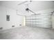 Garage with automatic door, concrete floors, and ample room for parking at 23113 Brewer Ave, Punta Gorda, FL 33980