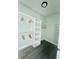 Bright walk-in closet featuring custom shelving and wooden hangers, perfect for organizing clothes and accessories at 23113 Brewer Ave, Punta Gorda, FL 33980