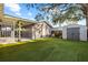 Spacious backyard with new turf, storage shed, patio and mature trees offering plenty of shade at 2912 W Frierson W Ave, Tampa, FL 33614