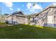 Backyard featuring a covered patio and new turf perfect for outdoor entertaining and relaxation at 2912 W Frierson W Ave, Tampa, FL 33614