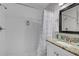 Clean bathroom featuring subway tile, granite vanity, and a shower with a shower curtain at 2912 W Frierson W Ave, Tampa, FL 33614