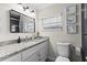 Bathroom features updated vanity with granite countertop, new fixtures and a modern design at 2912 W Frierson W Ave, Tampa, FL 33614