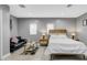 Large bedroom featuring natural light, stylish decor, and a sitting area for comfortable living at 2912 W Frierson W Ave, Tampa, FL 33614
