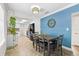 Open dining area featuring tile floors, decorative lighting, and a blue accent wall at 2912 W Frierson W Ave, Tampa, FL 33614