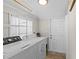 Functional laundry room with washer, dryer, and storage area at 2912 W Frierson W Ave, Tampa, FL 33614