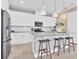 Modern kitchen with stainless steel appliances, a center island, and pendant lighting at 9143 Players Dr, Weeki Wachee, FL 34613
