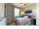 Cozy bedroom features neutral walls, a window with views, and decorative art accents at 9176 Players Dr, Weeki Wachee, FL 34613