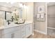Elegant bathroom featuring double sinks, stylish fixtures, and ample counter space at 9177 Players Dr, Weeki Wachee, FL 34613