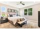 Comfortable bedroom with plush carpeting, natural light, and serene decor for relaxing ambiance at 9177 Players Dr, Weeki Wachee, FL 34613