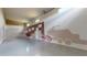 Spacious garage with painted vehicle outlines on the wall and natural lighting, ideal for storage or hobbies at 9177 Players Dr, Weeki Wachee, FL 34613