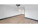 Bright, open room with hardwood floors, a ceiling fan, neutral walls, and dark trim at 2353 Shelley St # 10, Clearwater, FL 33765