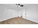Bright bedroom with wood floors and double door closet space at 2353 Shelley St # 18, Clearwater, FL 33765