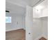 Bright walk-in closet featuring built-in shelving and hanging rod near bedroom at 2353 Shelley St # 18, Clearwater, FL 33765