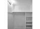Bright walk-in closet featuring built-in shelving and hanging rod at 2353 Shelley St # 18, Clearwater, FL 33765
