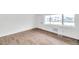 Living area showcasing hard surface floors, freshly painted white walls and bright window at 2353 Shelley St # 18, Clearwater, FL 33765