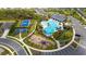 Aerial view of community amenities including pool, playground, basketball, and tennis courts at 3884 Capri Coast Dr, Plant City, FL 33565