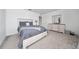 Comfortable bedroom with neutral tones, a queen-size bed, and ample natural light at 3884 Capri Coast Dr, Plant City, FL 33565