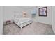 Comfortable bedroom featuring a cozy bed, soft carpet, and natural light from the window at 3884 Capri Coast Dr, Plant City, FL 33565