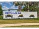 North Park Isle community sign surrounded by landscaping and palm trees at 3884 Capri Coast Dr, Plant City, FL 33565