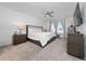 Serene main bedroom featuring a comfortable bed, stylish furnishings, and ample natural light at 3884 Capri Coast Dr, Plant City, FL 33565