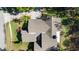 An aerial view shows the roof and landscaping surrounding the property at 1025 Royal Troon Ct, Tarpon Springs, FL 34688