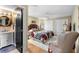 Comfortable bedroom features an en-suite bath, hardwood floors, natural lighting and neutral decor at 1025 Royal Troon Ct, Tarpon Springs, FL 34688