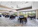 Elegant dining area with large windows overlooking a beautiful outdoor view and neutral carpet at 1025 Royal Troon Ct, Tarpon Springs, FL 34688