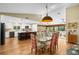 Open floor plan features a dining area and kitchen with a breakfast bar at 1025 Royal Troon Ct, Tarpon Springs, FL 34688