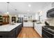 Eat-in kitchen featuring custom cabinetry, stainless steel appliances, and an eat-in island at 1025 Royal Troon Ct, Tarpon Springs, FL 34688