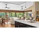 Living room filled with natural light featuring views of the backyard from the island at 1025 Royal Troon Ct, Tarpon Springs, FL 34688