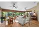 Living room with floor-to-ceiling windows offers beautiful natural light at 1025 Royal Troon Ct, Tarpon Springs, FL 34688