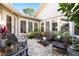 Paver patio featuring outdoor seating and lush landscaping at 1025 Royal Troon Ct, Tarpon Springs, FL 34688